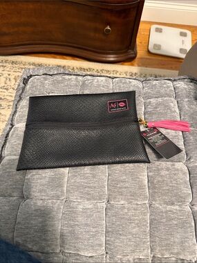 Makeup Junkie Black Cosmetic Bag with Pink Tassel